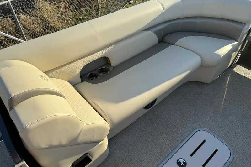 Slide: The Image of Luxurious seating on 2021 Premier 250 RE Sunsation LTD pontoon boat with cup holders. - 7