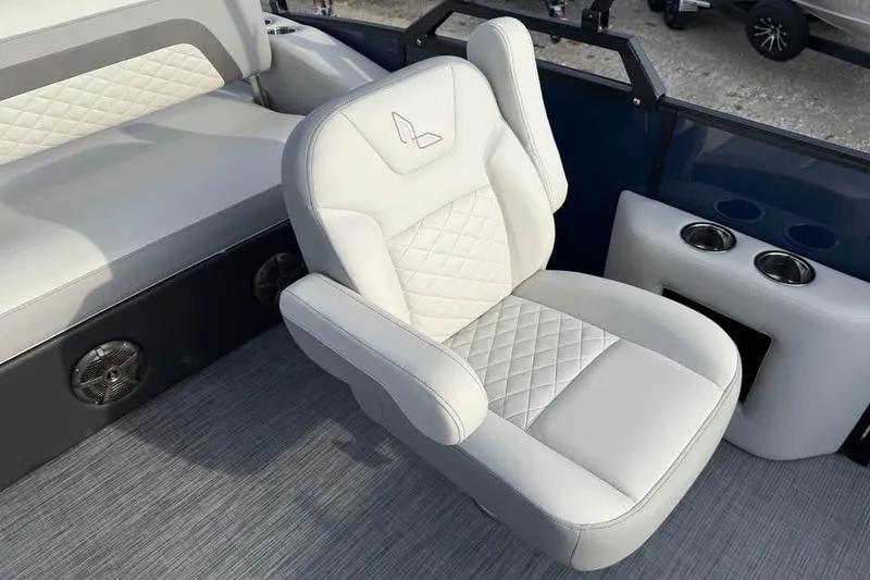 Slide: The Image of 2026 Lowe SS 230 DV boat interior with luxurious white seating and cup holders. - 12