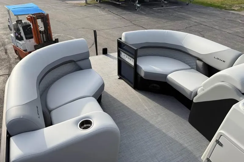 Slide: The Image of 2026 Lowe SS 230 DV boat interior with plush gray seating and modern design. - 13