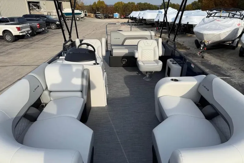 Slide: The Image of 2026 Lowe SS 230 DV pontoon boat with spacious seating and modern design. - 14