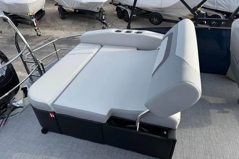 Slide: The Image of 2026 Lowe SS 230 DV boat with adjustable seating and cup holders on deck. - 7