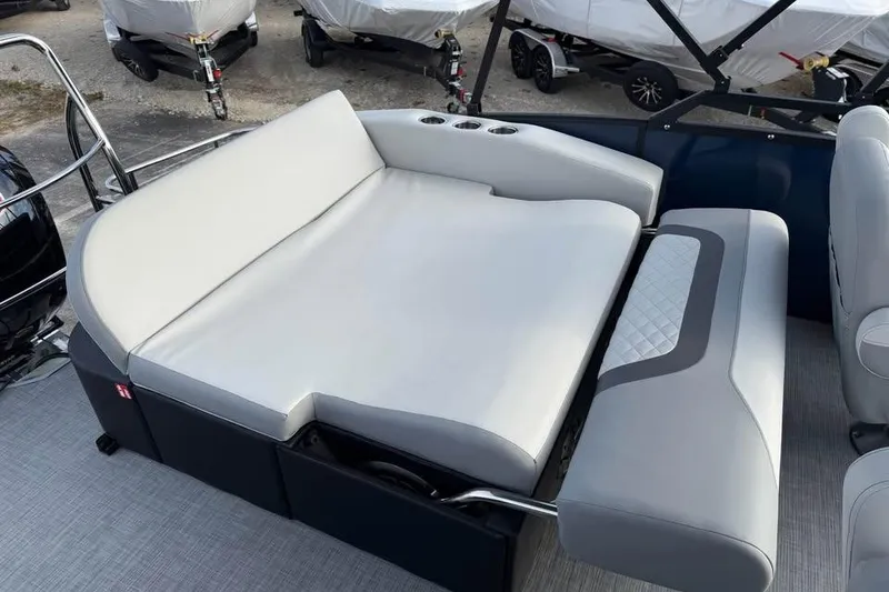 Slide: The Image of 2026 Lowe SS 230 DV boat interior with plush seating and cup holders. - 9