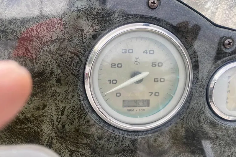 Slide: The Image of Close-up of a 2005 Hurricane FunDeck 196 FF speedometer, showing 42.3 hours. - 10