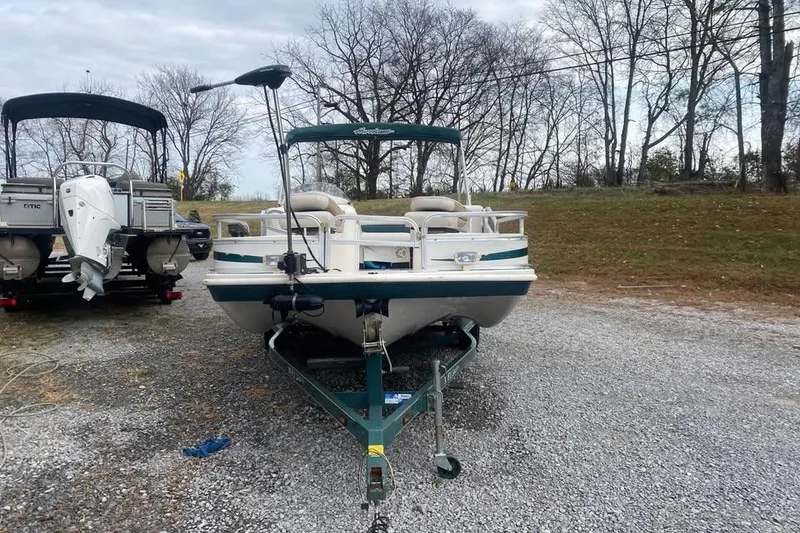 Slide: The Image of 2005 Hurricane FunDeck 196 FF boat on trailer, parked on gravel lot. - 3