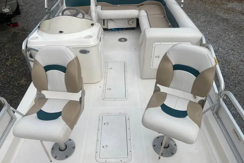 Slide: The Image of 2005 Hurricane FunDeck 196 FF boat interior with swivel seats and steering console. - 5
