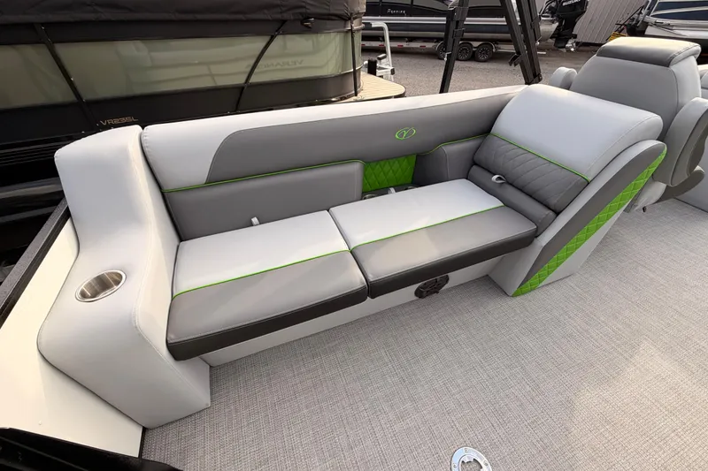 Slide: The Image of 2026 Veranda Vista Sport VS25RC boat interior with modern gray and green seating. - 10