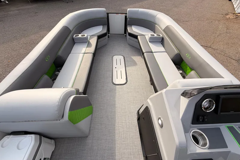 Slide: The Image of 2026 Veranda Vista Sport VS25RC pontoon boat interior with gray seating and green accents. - 11