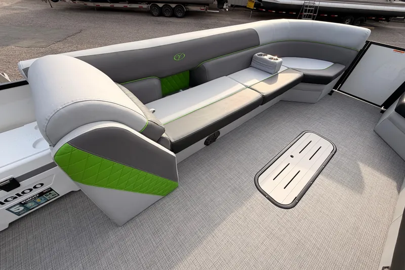 Slide: The Image of 2026 Veranda Vista Sport VS25RC boat interior with gray and green seating. - 12