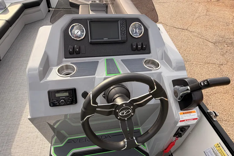 Slide: The Image of 2026 Veranda Vista Sport VS25RC boat dashboard with steering wheel and controls. - 23