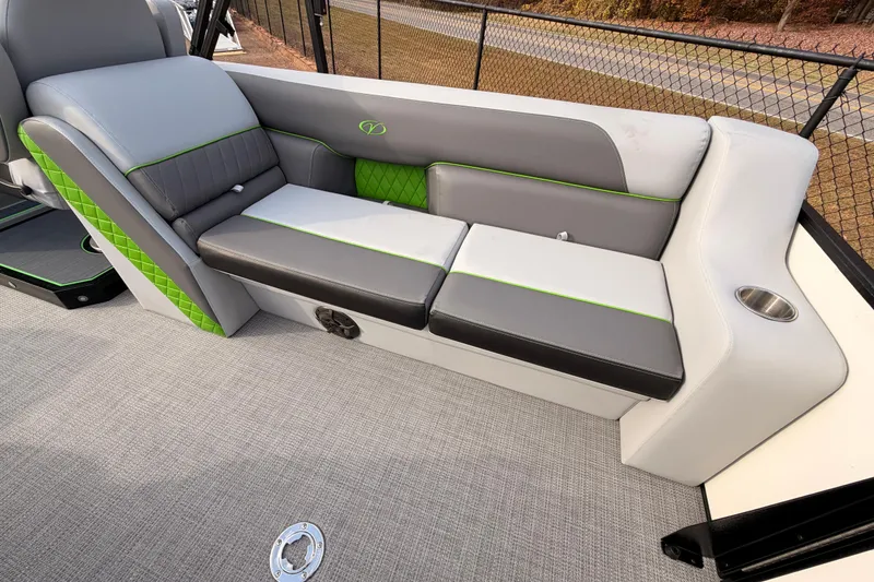 Slide: The Image of 2026 Veranda Vista Sport VS25RC boat interior with gray and green seating. - 9