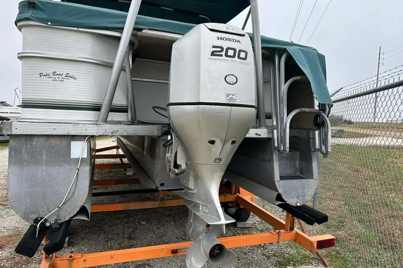 Slide: The Image of 2004 PlayCraft Powertoon 26 pontoon boat with Honda 200 outboard motor on trailer. - 5