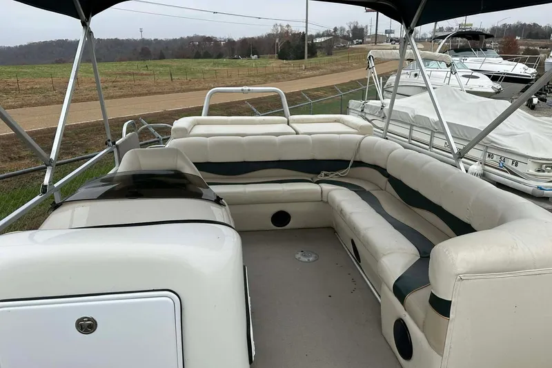 Slide: The Image of 2004 PlayCraft Powertoon 26 pontoon boat with spacious seating and canopy. - 6