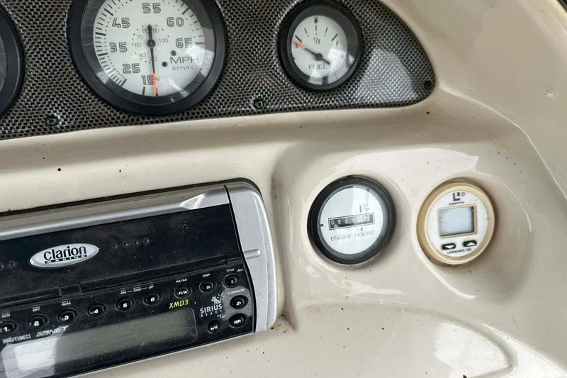 Slide: The Image of Dashboard of 2004 PlayCraft Powertoon 26 with gauges and Clarion stereo system. - 7