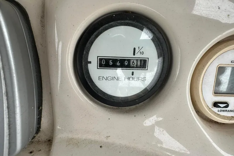 Slide: The Image of 2004 PlayCraft Powertoon 26 engine hour meter showing 549.6 hours. - 8