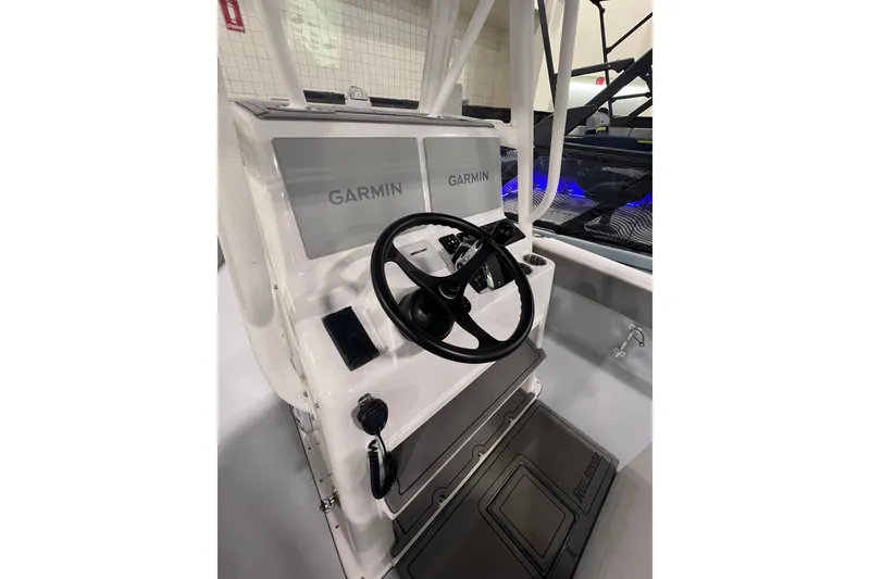 Slide: The Image of 2024 Reef Runner 230 Open boat cruising on open ocean waters. - 11