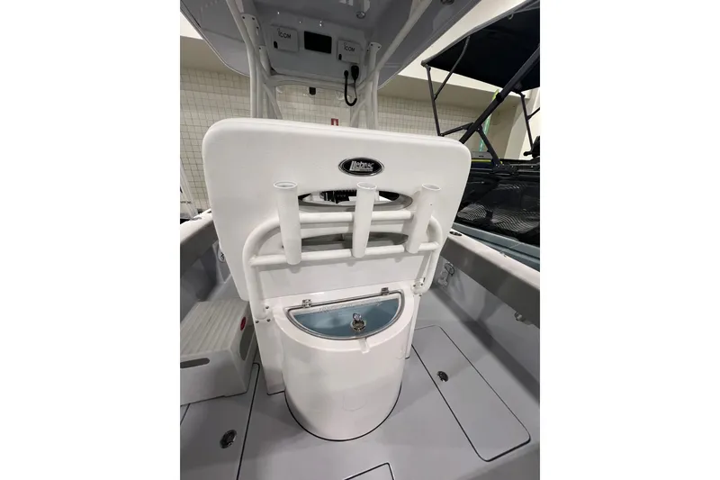 Slide: The Image of 2024 Reef Runner 230 Open boat cruising on open ocean waters. - 2