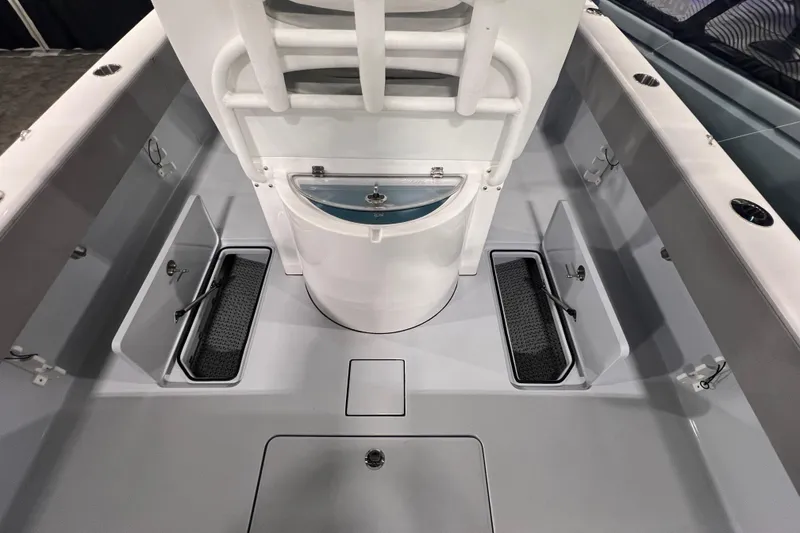 Slide: The Image of 2024 Reef Runner 230 Open boat navigating ocean waves under clear blue sky. - 4