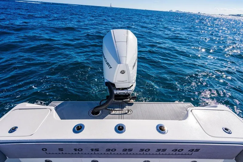 Slide: The Image of 2024 Reef Runner 230 Open boat with Mercury engine on open water. - 51