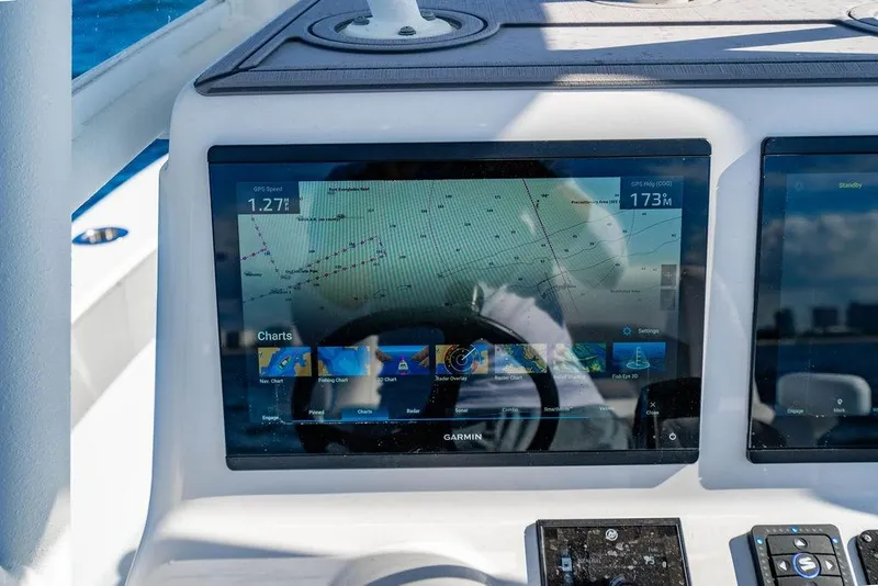 Slide: The Image of Garmin navigation display on 2024 Reef Runner 230 Open boat dashboard. - 66