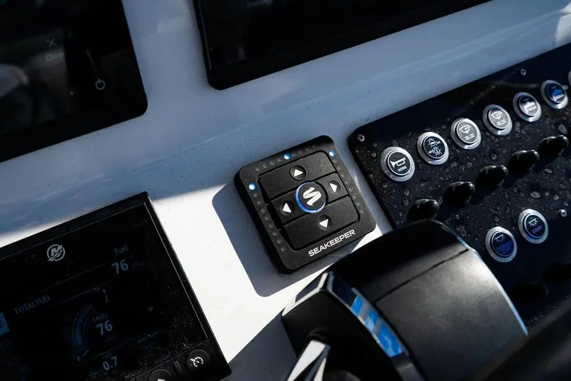 Slide: The Image of Control panel of 2024 Reef Runner 230 Open boat with Seakeeper system. - 68