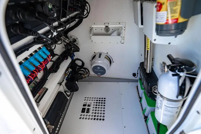 Slide: The Image of Electrical and mechanical compartment of 2024 Reef Runner 230 Open boat. - 78