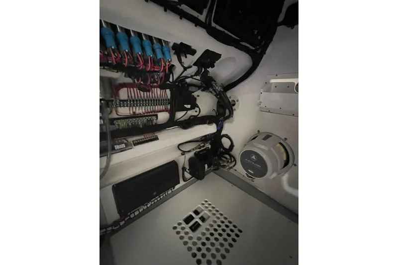 Slide: The Image of 2024 Reef Runner 230 Open boat cruising on clear blue ocean waters. - 9