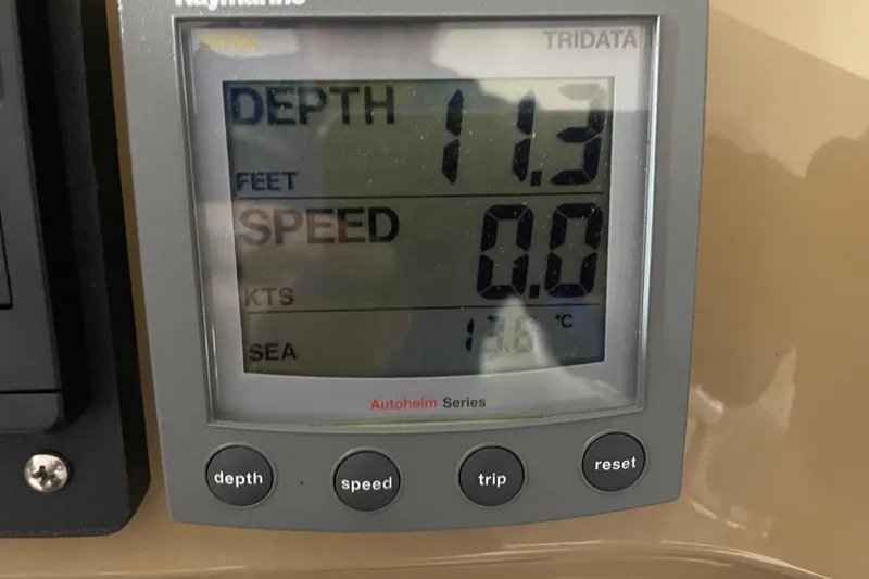 Slide: The Image of Depth and speed display on 2004 Carver 460 Voyager boat, showing 11.3 feet depth. - 11