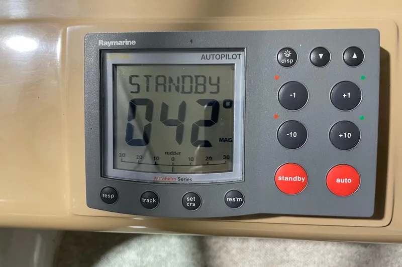 Slide: The Image of Raymarine autopilot display on 2004 Carver 460 Voyager, showing standby mode at 042 degrees. - 12