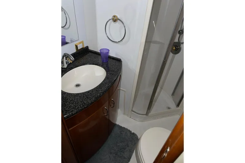 Slide: The Image of Bathroom interior of 2004 Carver 460 Voyager yacht with sink and shower. - 23