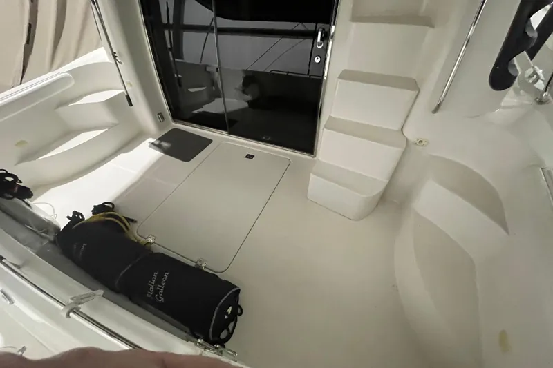 Slide: The Image of 2004 Carver 460 Voyager yacht interior with steps and storage area. - 4