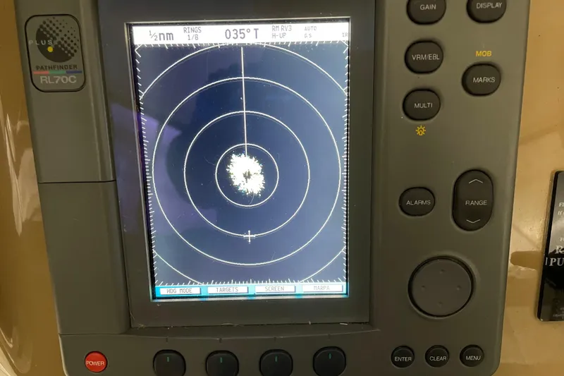 Slide: The Image of Radar display on a 2004 Carver 460 Voyager boat, showing navigation data. - 9
