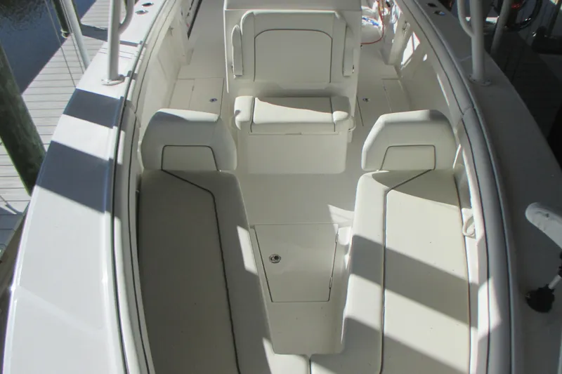 Slide: The Image of 2012 Jupiter 30 FS boat interior with white seating and deck. - 19