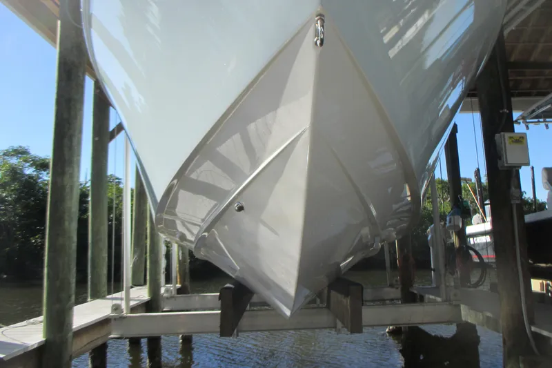 Slide: The Image of 2012 Jupiter 30 FS boat on lift, viewed from the bow. - 3