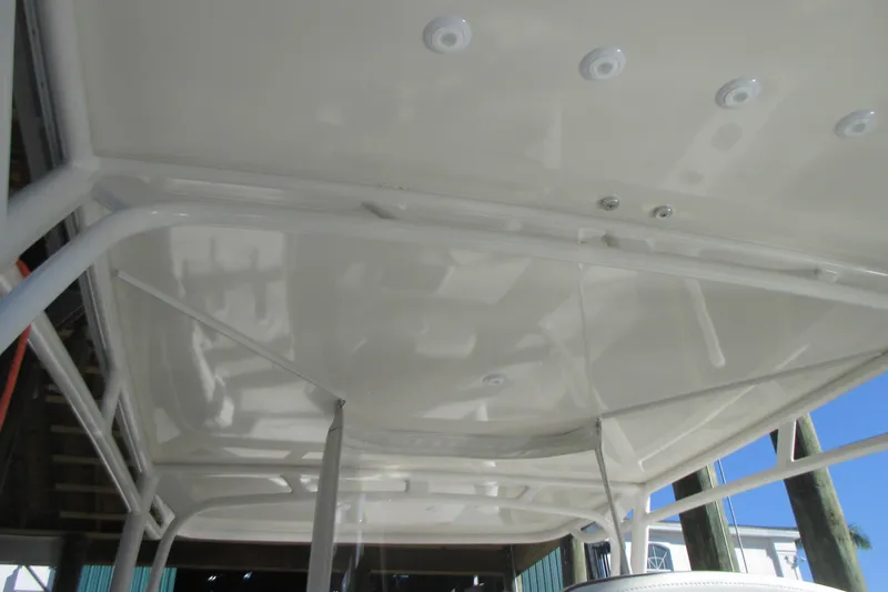 Slide: The Image of 2012 Jupiter 30 FS boat hardtop with mounted lights and sturdy framework. - 6