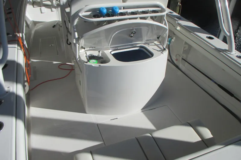Slide: The Image of 2012 Jupiter 30 FS boat interior with open storage compartment and seating area. - 7