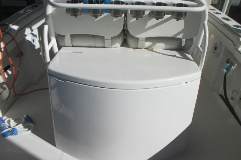 Slide: The Image of 2012 Jupiter 30 FS boat interior with rod holders and storage compartment. - 8