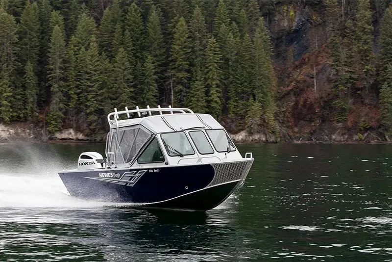 Slide: The Image of 2026 Hewescraft 200 ProV ET HT boat cruising on a scenic lake. - 15