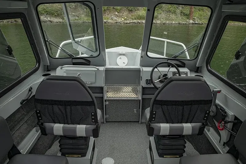 Slide: The Image of 2026 Hewescraft 200 ProV ET Hardtop boat displayed indoors on a trailer. - 3