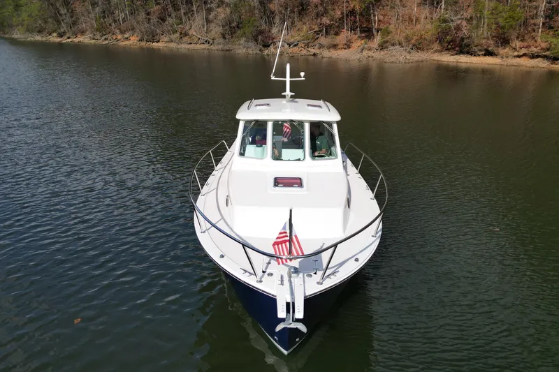 Slide: The Image of Aerial view of 2008 Back Cove 29 boat cruising on water. - 5