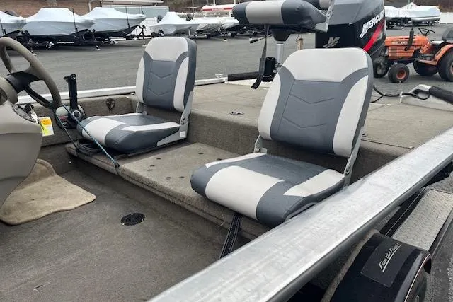 Slide: The Image of 2003 Tracker Pro Team 185 boat interior with gray seats and steering wheel. - 11