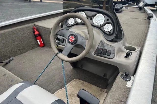 Slide: The Image of 2003 Tracker Pro Team 185 boat interior with steering wheel and gauges. - 13