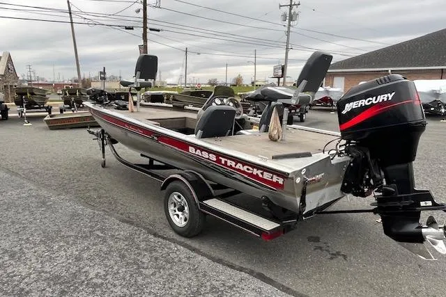 Slide: The Image of 2003 Tracker Pro Team 185 bass boat with Mercury outboard motor on trailer. - 7