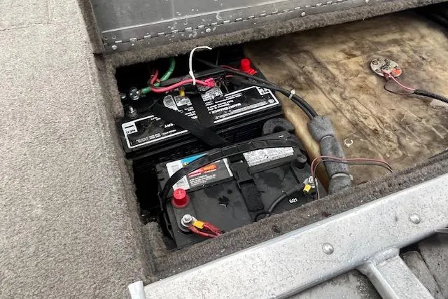 Slide: The Image of Battery compartment of a 2003 Tracker Pro Team 185 boat, showing wiring and connections. - 8