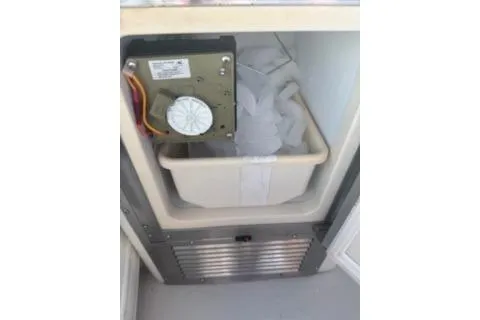 Slide: The Image of Ice maker inside 2005 Carver 36 Mariner boat, partially filled with ice. - 12