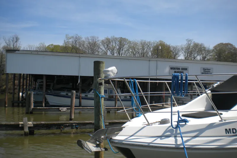 Slide: The Image of 2005 Carver 36 Mariner docked at Worton Creek Marina under clear skies. - 18