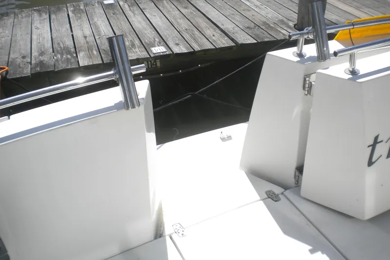 Slide: The Image of 2005 Carver 36 Mariner yacht docked at a wooden pier. - 21