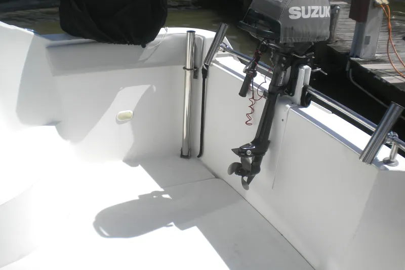 Slide: The Image of 2005 Carver 36 Mariner boat interior with Suzuki outboard motor. - 22