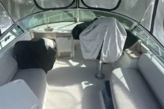 Slide: The Image of 2005 Carver 36 Mariner boat interior with seating and covered controls. - 7