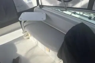 Slide: The Image of 2005 Carver 36 Mariner boat interior with seating and table. - 9