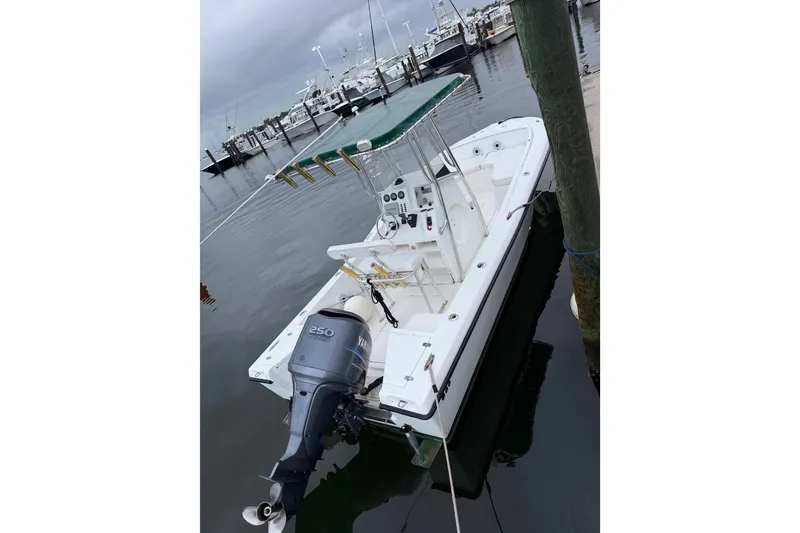Slide: The Image of Custom 2003 23 Center Console boat docked with Yamaha 250 outboard motor. - 10